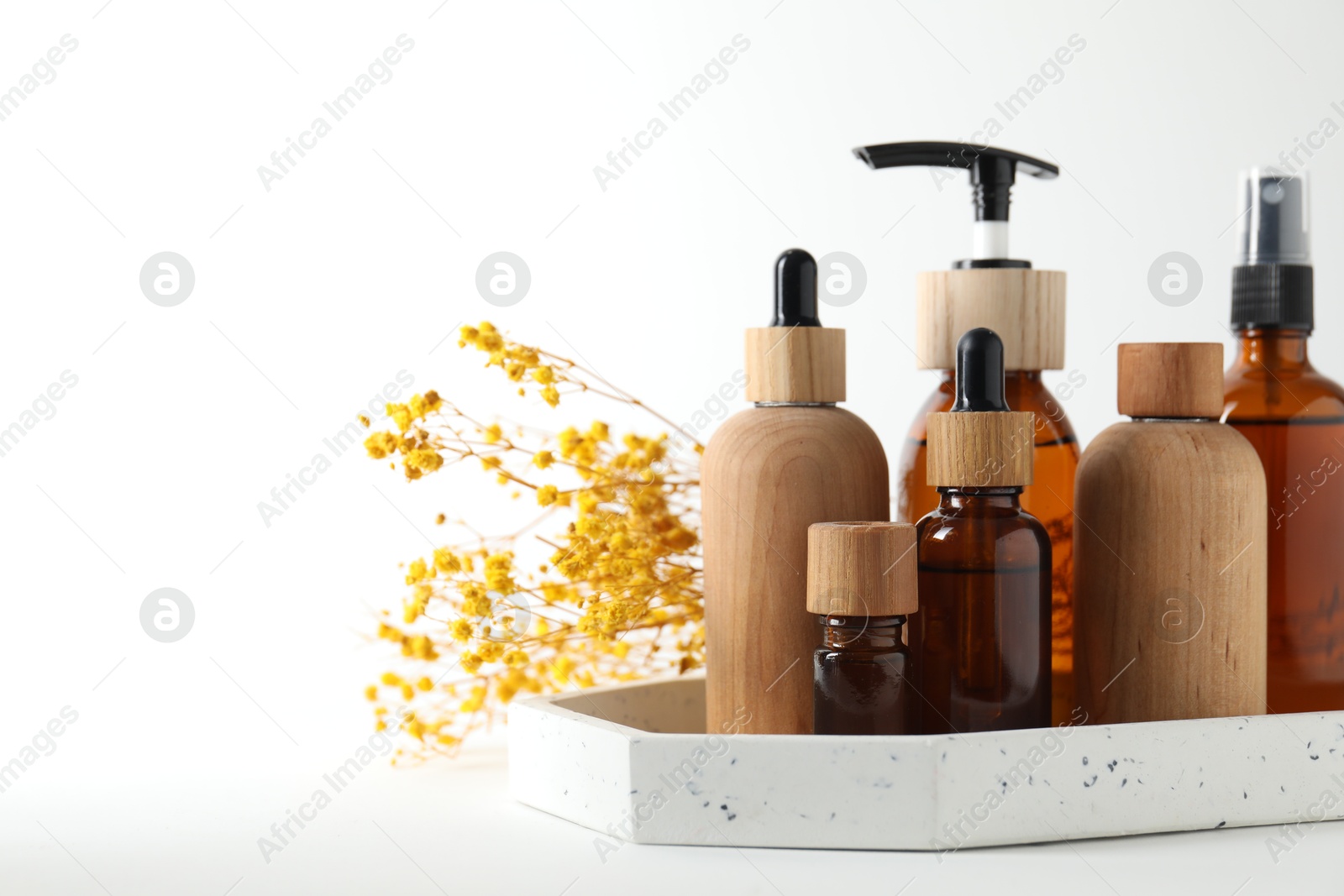 Photo of Different cosmetic products and gypsophila flowers on white background, space for text