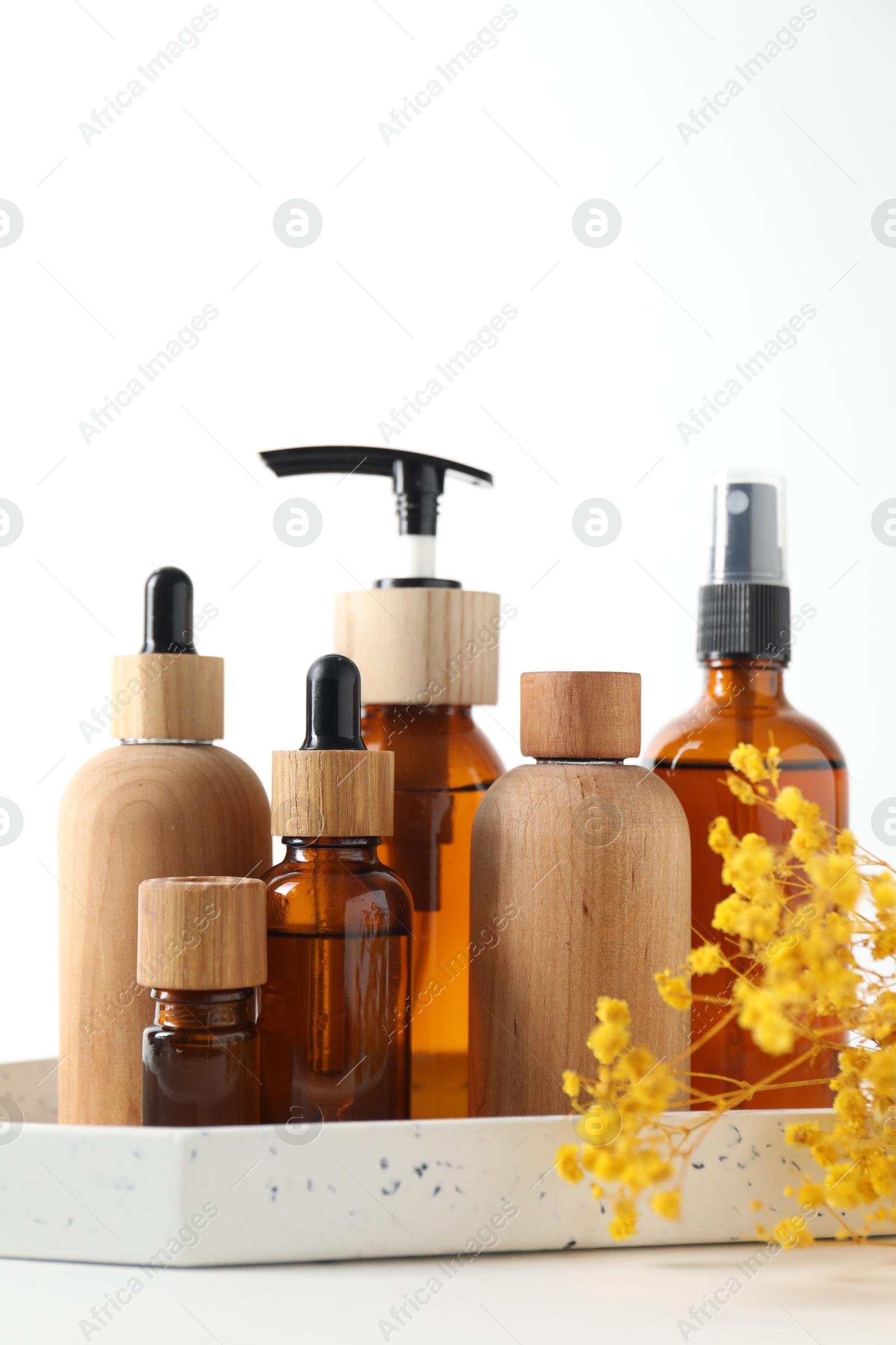 Photo of Different cosmetic products and gypsophila flowers on white background