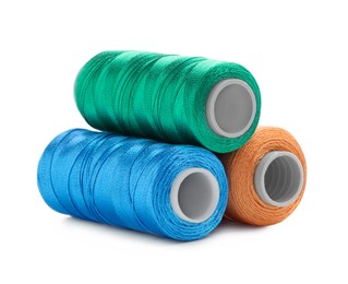 Photo of Spools of bright sewing threads isolated on white