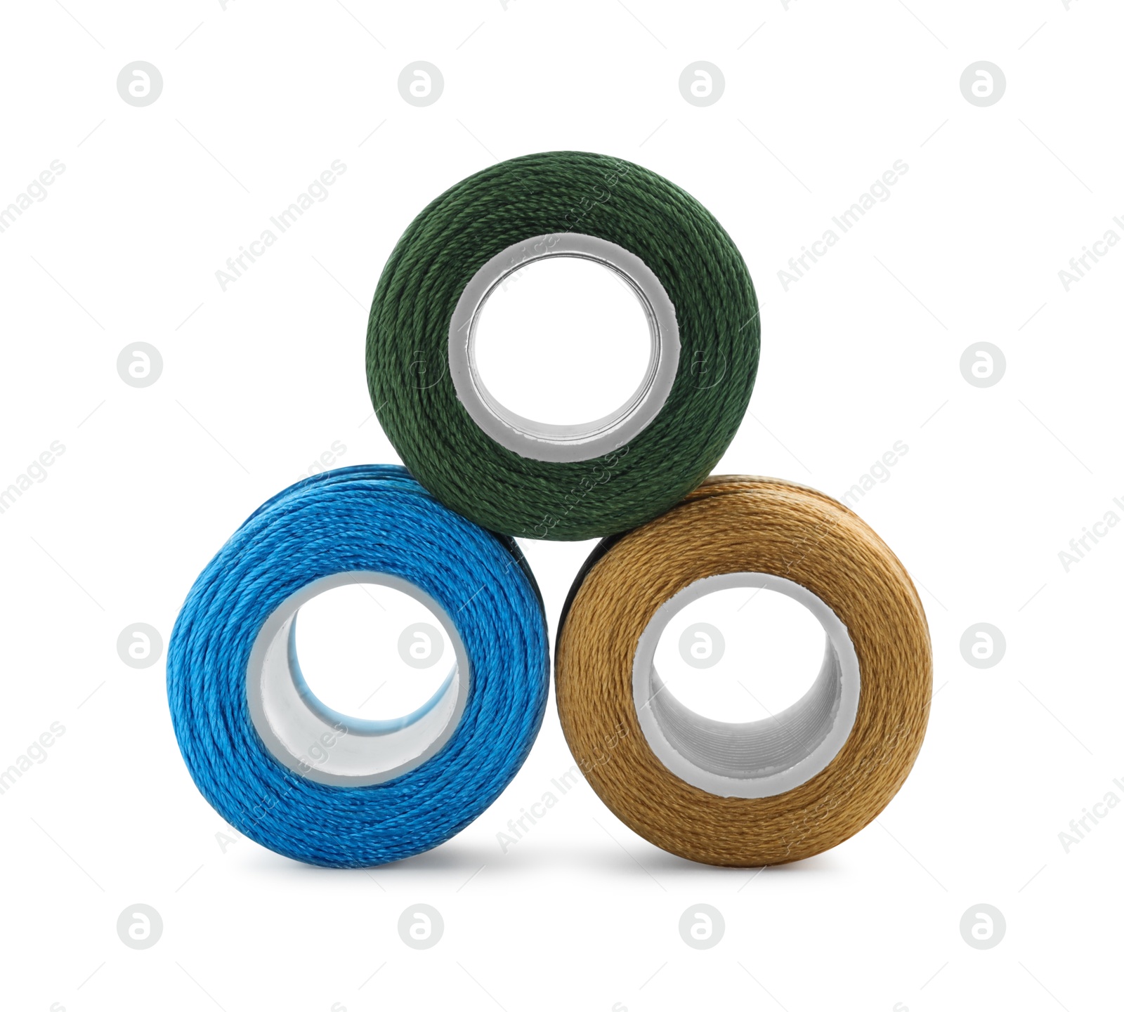 Photo of Spools of bright sewing threads isolated on white