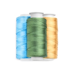 Photo of Spools of bright sewing threads isolated on white, top view