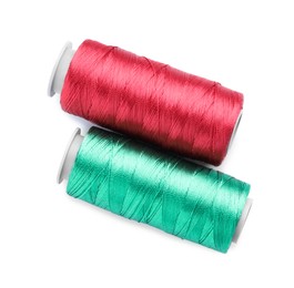 Photo of Spools of bright sewing threads isolated on white, top view