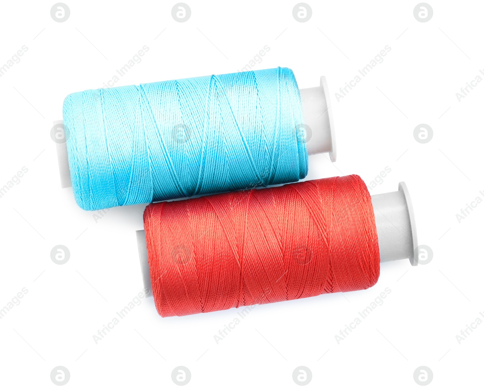 Photo of Spools of bright sewing threads isolated on white, top view