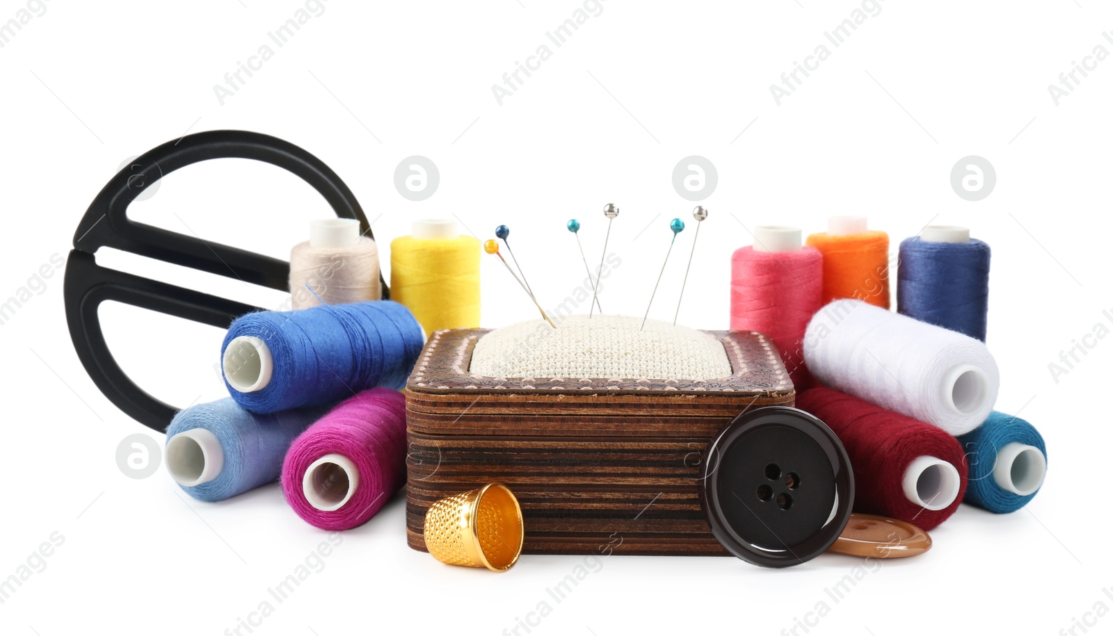 Photo of Threads and other sewing supplies isolated on white