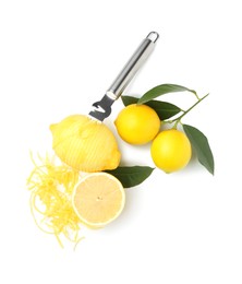 Photo of Lemon zest, fresh fruits and zester tool isolated on white, top view