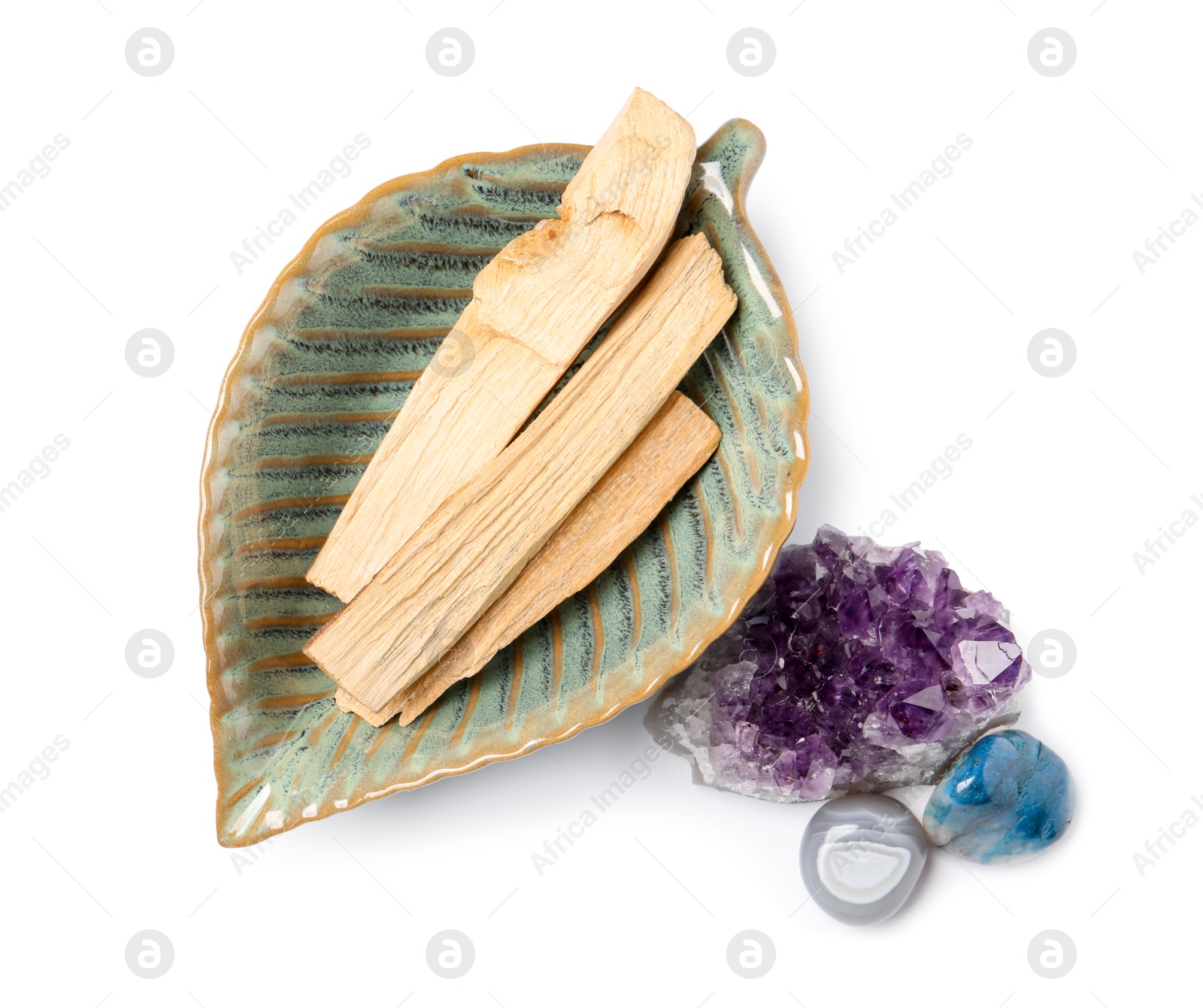 Photo of Palo santo sticks and gemstones isolated on white, top view