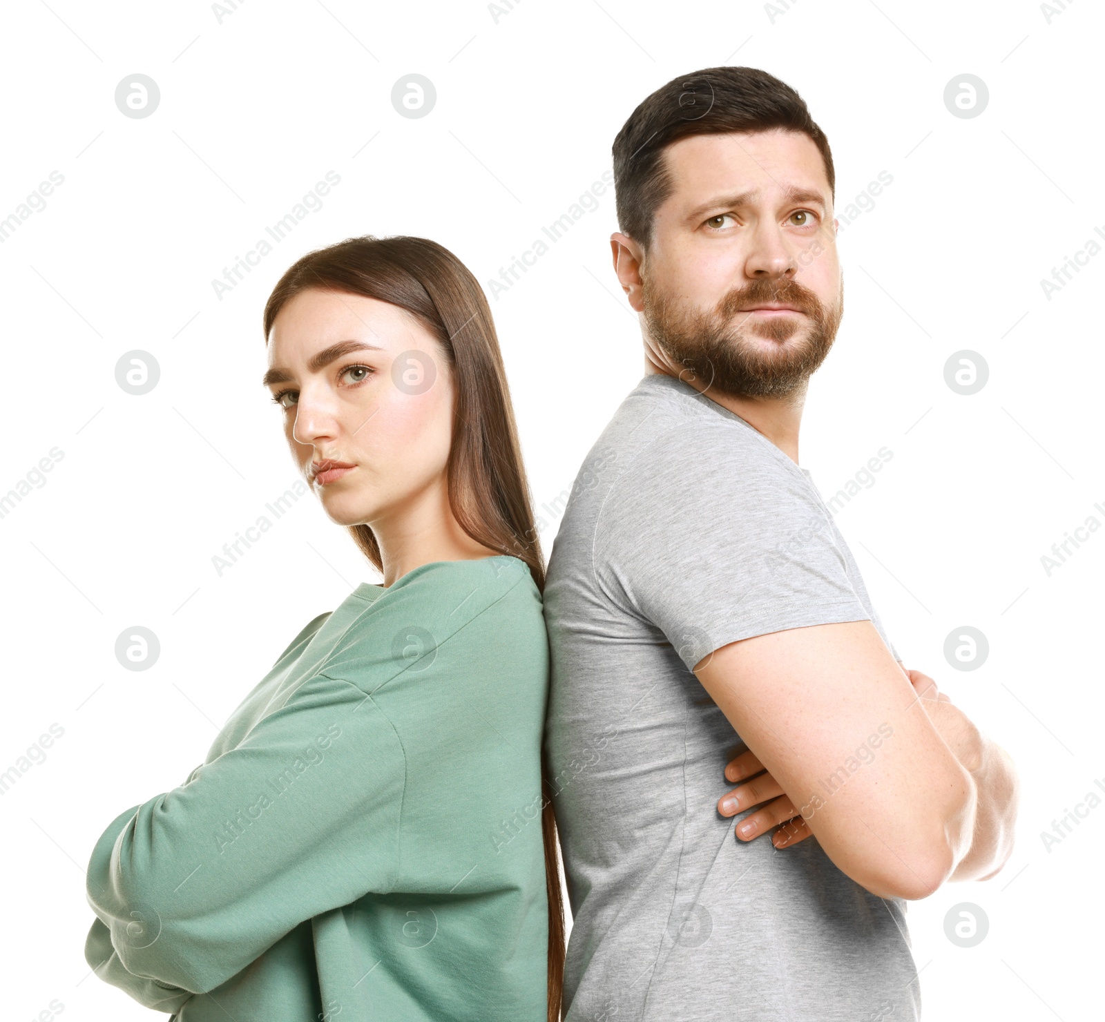 Photo of Resentful couple with crossed arms on white background