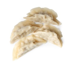 Photo of Tasty boiled gyoza (dumplings) isolated on white