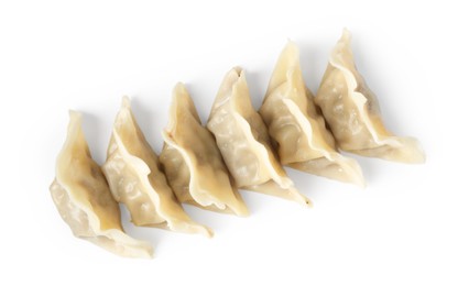 Photo of Tasty boiled gyoza (dumplings) isolated on white, top view