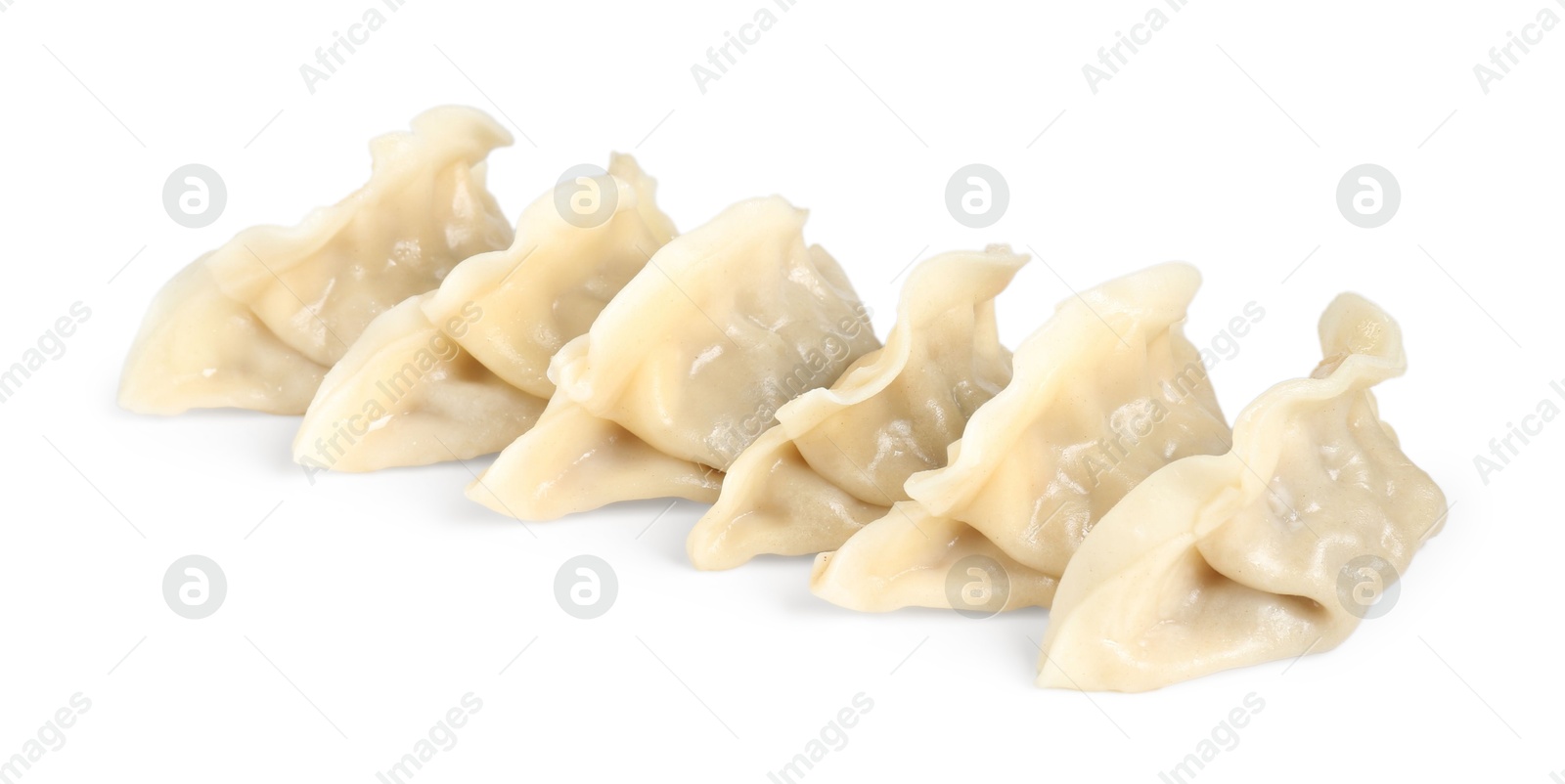 Photo of Tasty boiled gyoza (dumplings) isolated on white