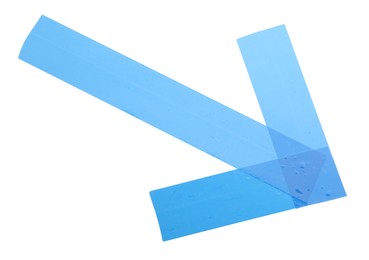 Photo of Arrow made of light blue adhesive tape on white background, top view