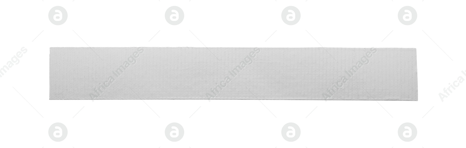 Photo of Strip of silver adhesive tape on white background, top view