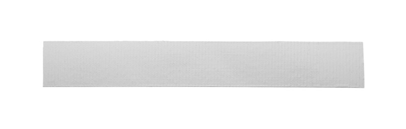 Photo of Strip of silver adhesive tape on white background, top view