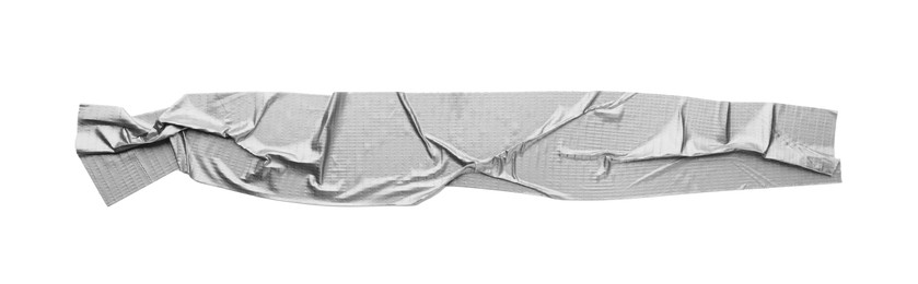 Photo of Wrinkled strip of silver adhesive tape on white background, top view