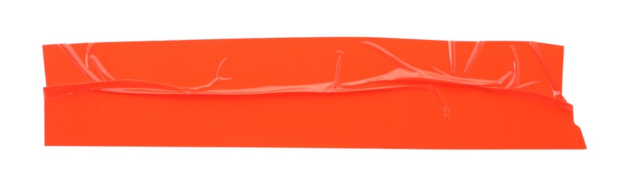 Photo of Strip of red adhesive tape on white background, top view