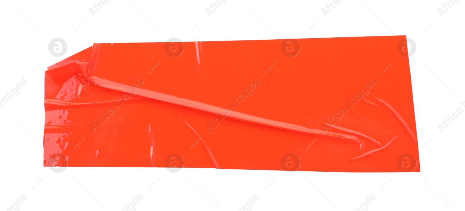 Photo of Strip of red adhesive tape on white background, top view