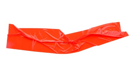 Photo of Strip of red adhesive tape on white background, top view