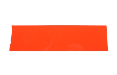 Photo of Strip of red adhesive tape on white background, top view