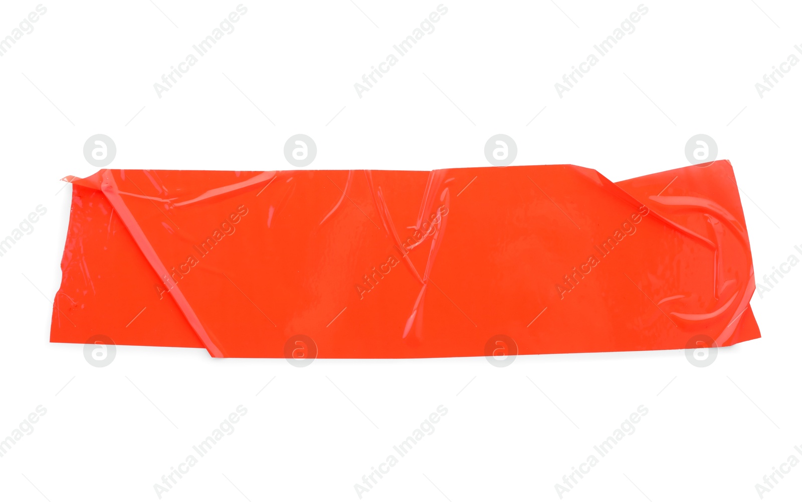 Photo of Strip of red adhesive tape on white background, top view