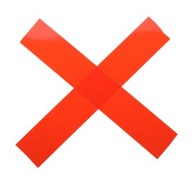 Photo of Cross made of red adhesive tape on white background, top view