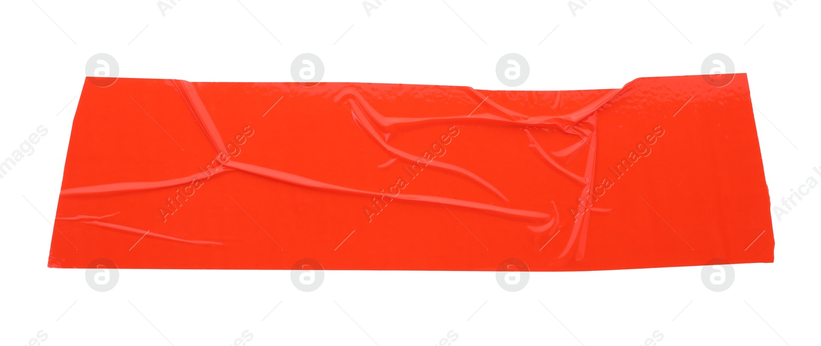 Photo of Strip of red adhesive tape on white background, top view