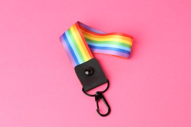 Photo of One keychain in LGBT colors on pink background, above view