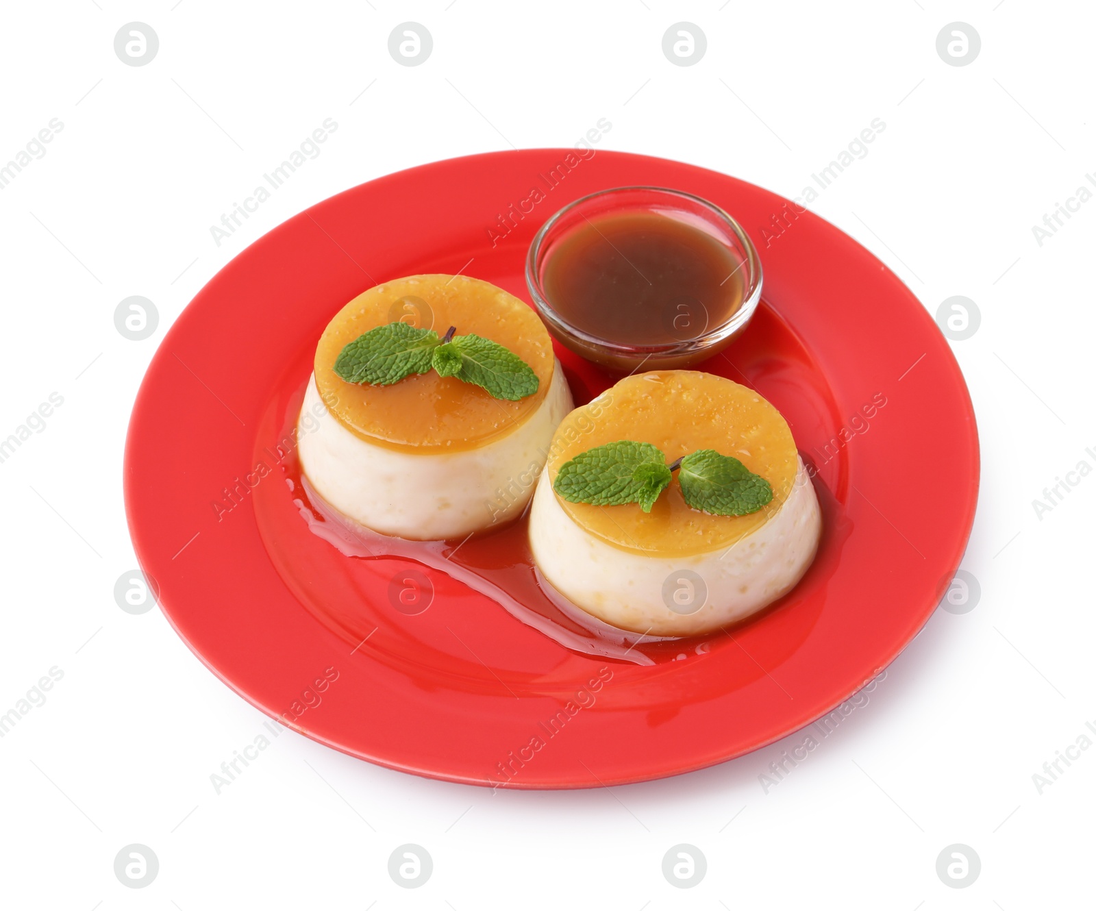 Photo of Tasty puddings with caramel sauce and mint isolated on white