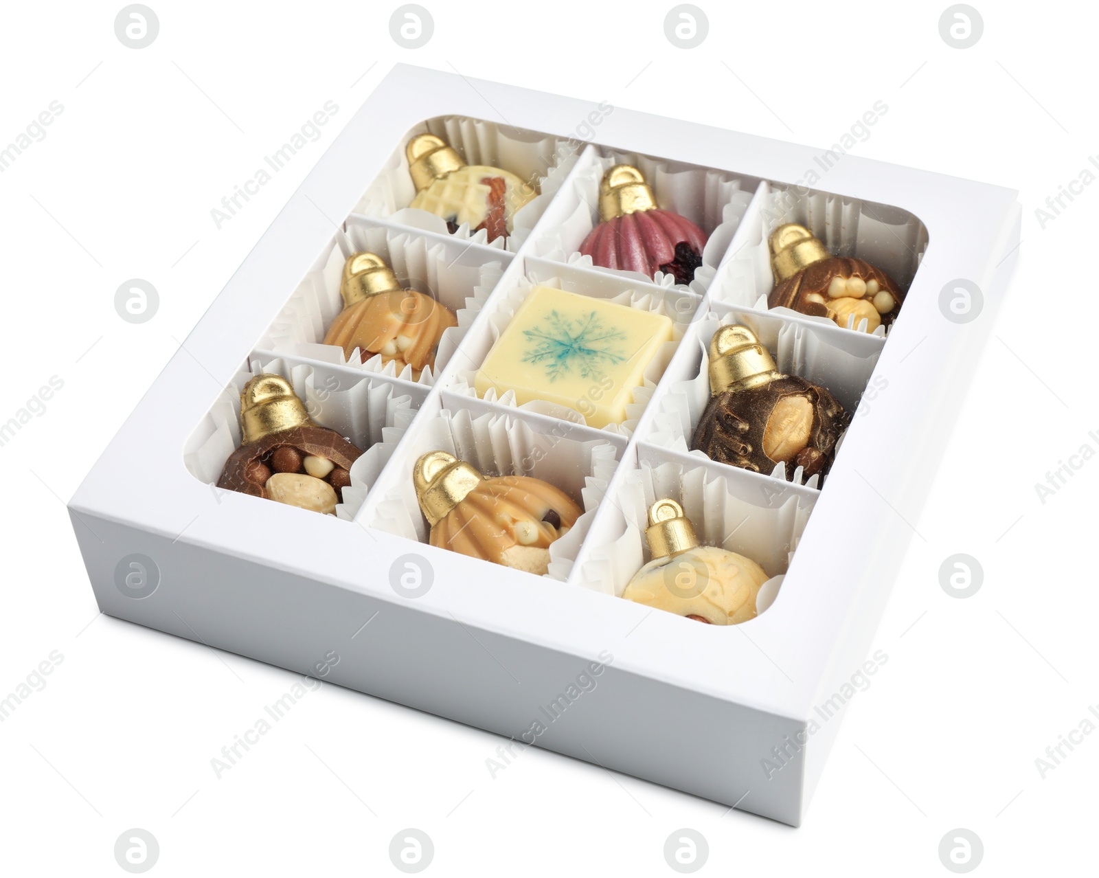 Photo of Box with delicious chocolate in shape of Christmas ornaments isolated on white