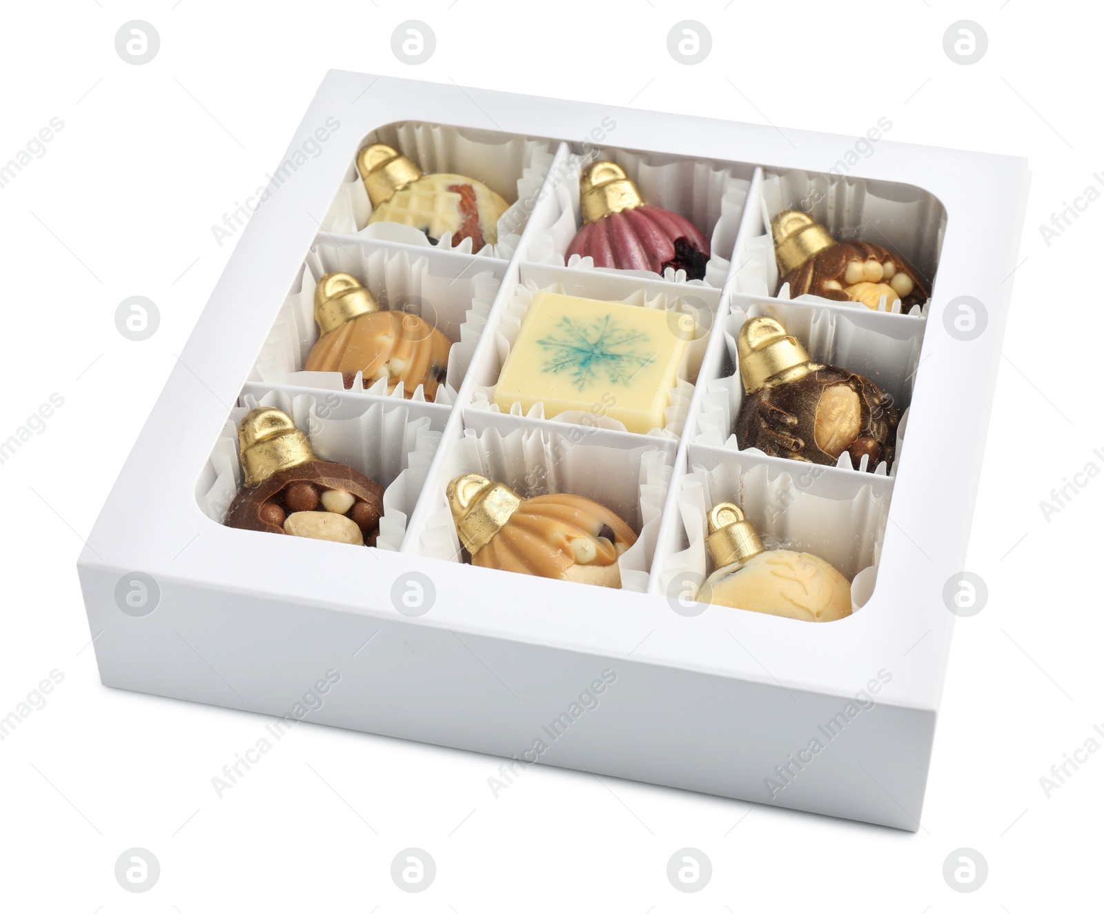 Photo of Box with delicious chocolate in shape of Christmas ornaments isolated on white