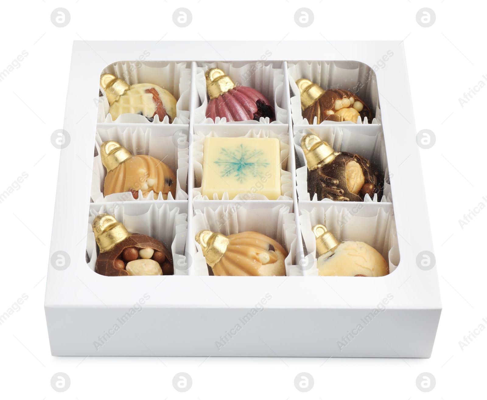 Photo of Box with delicious chocolate in shape of Christmas ornaments isolated on white