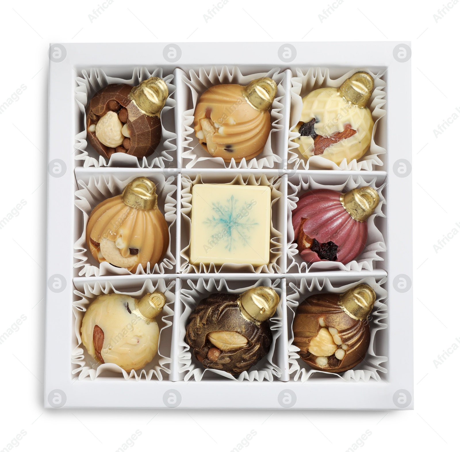 Photo of Box with delicious chocolate in shape of Christmas ornaments isolated on white, top view