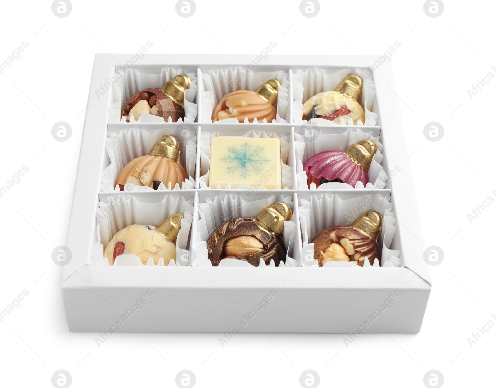 Photo of Box with delicious chocolate in shape of Christmas ornaments isolated on white