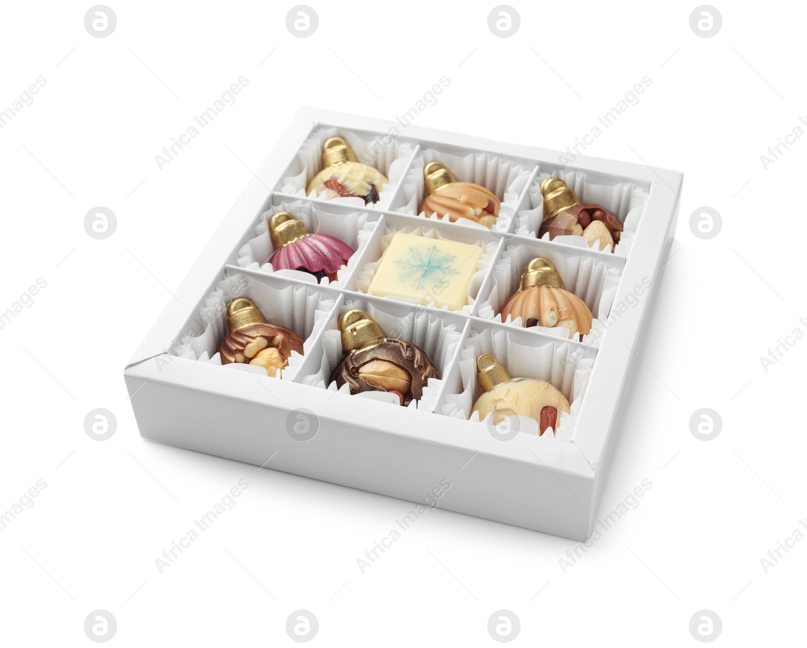 Photo of Box with delicious chocolate in shape of Christmas ornaments isolated on white