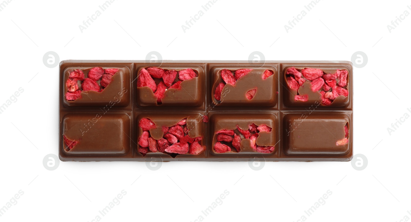 Photo of One tasty chocolate bar with pieces of raspberry isolated on white, top view