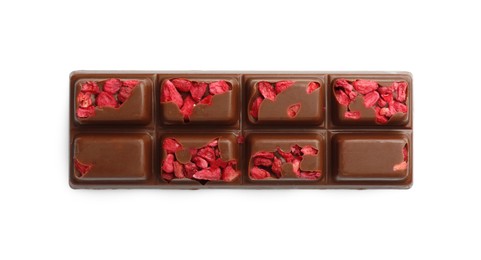 Photo of One tasty chocolate bar with pieces of raspberry isolated on white, top view