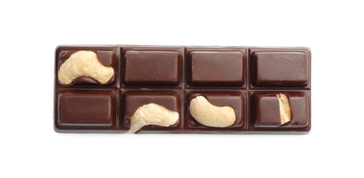 Photo of One tasty chocolate bar with cashew nuts isolated on white, top view