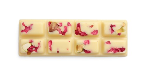 Photo of One tasty chocolate bar with pieces of raspberries and nuts isolated on white, top view