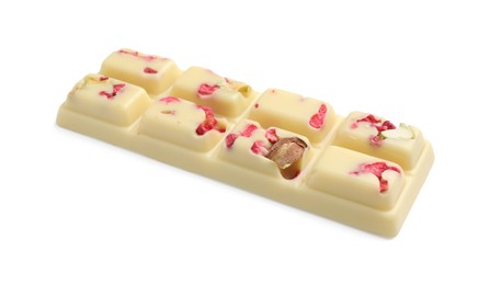 Photo of One tasty chocolate bar with pieces of raspberries and nuts isolated on white