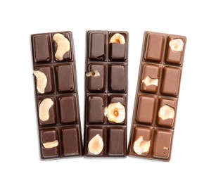 Photo of Tasty chocolate bars with nuts isolated on white, top view