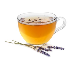 Photo of Aromatic lavender tea in glass cup and dry flowers isolated on white