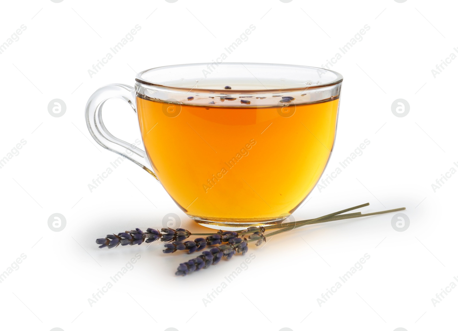 Aromatic lavender tea in glass cup and dry flowers isolated on white Photo of Aromatic lavender tea in glass cup and dry flowers isolated on white