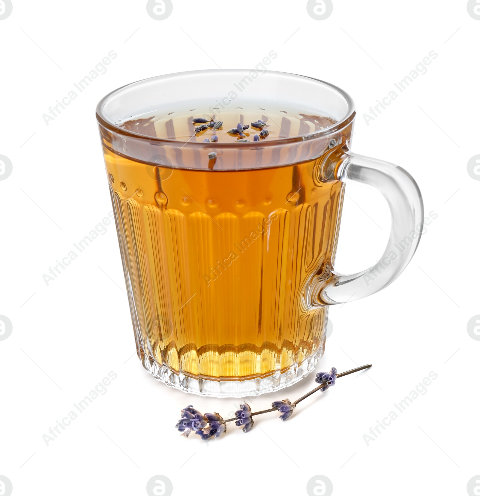 Photo of Aromatic lavender tea in glass cup and dry flowers isolated on white