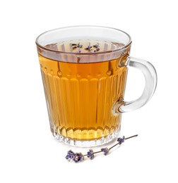 Photo of Aromatic lavender tea in glass cup and dry flowers isolated on white