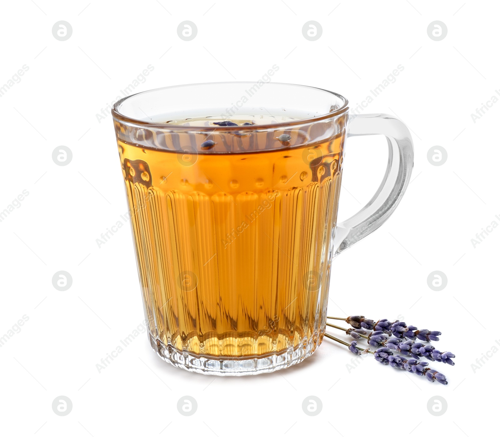 Photo of Aromatic lavender tea in glass cup and dry flowers isolated on white