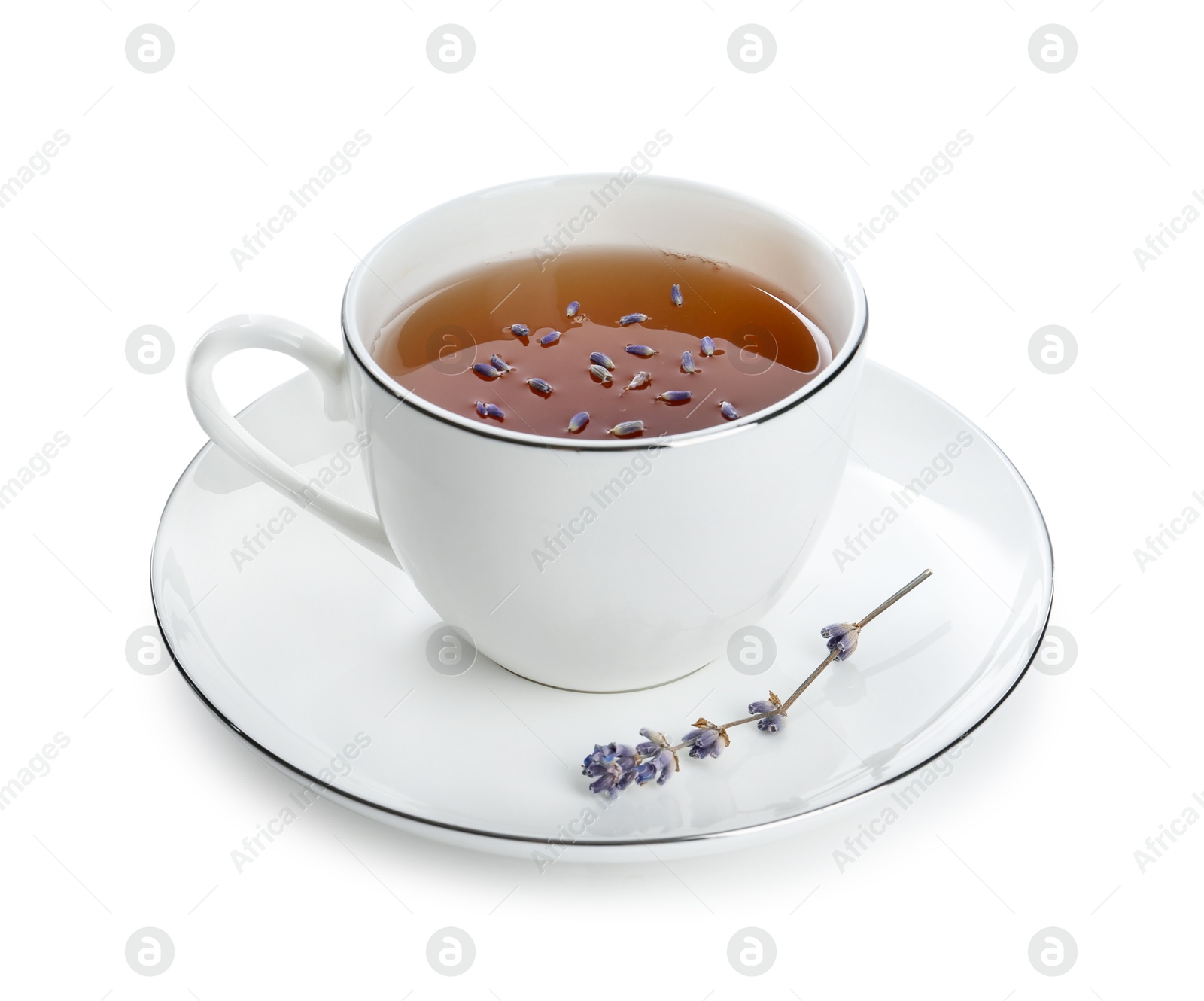 Photo of Aromatic lavender tea in cup and dry flowers isolated on white