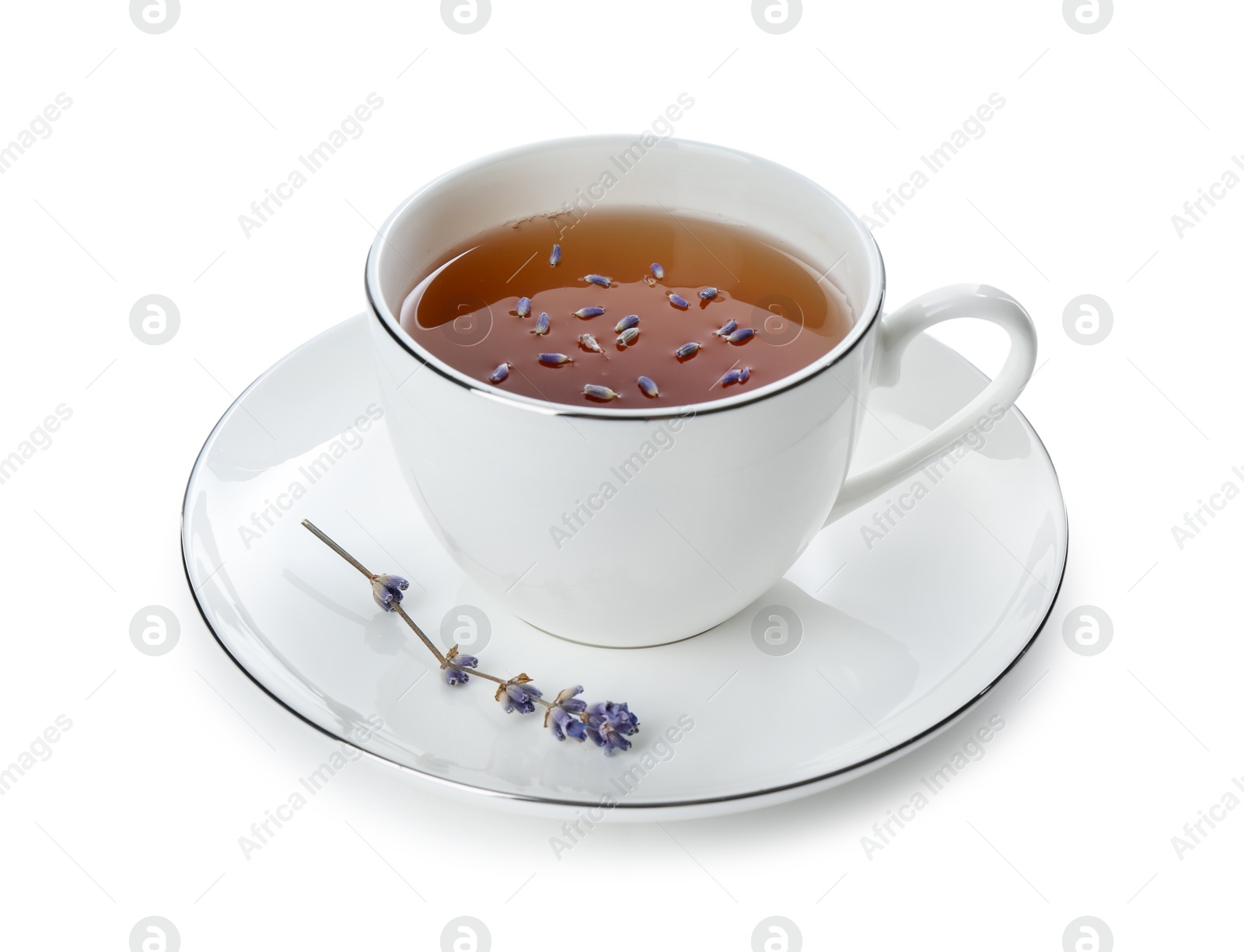 Aromatic lavender tea in cup and dry flowers isolated on white Photo of Aromatic lavender tea in cup and dry flowers isolated on white
