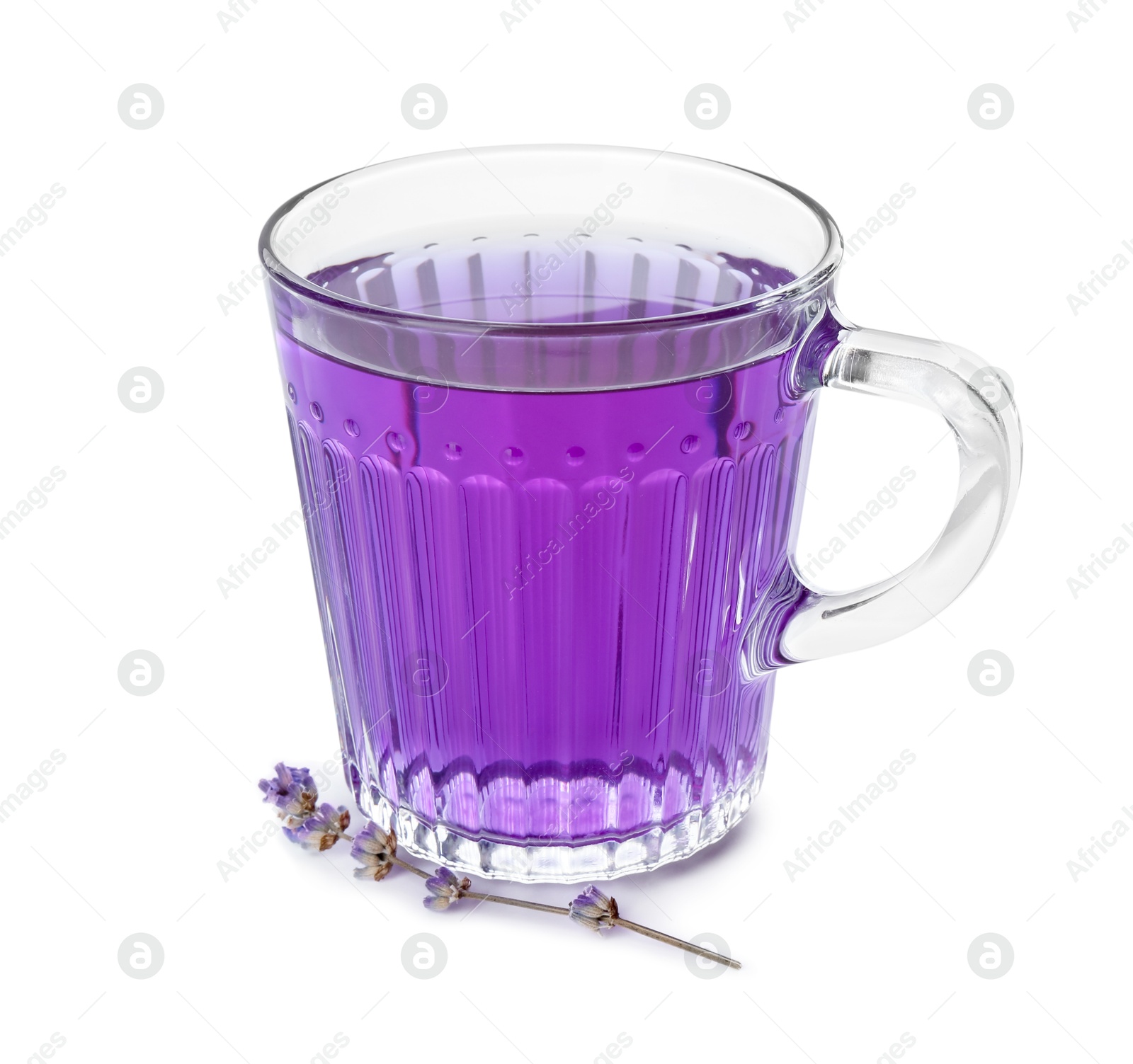 Photo of Aromatic lavender tea in glass cup and dry flowers isolated on white