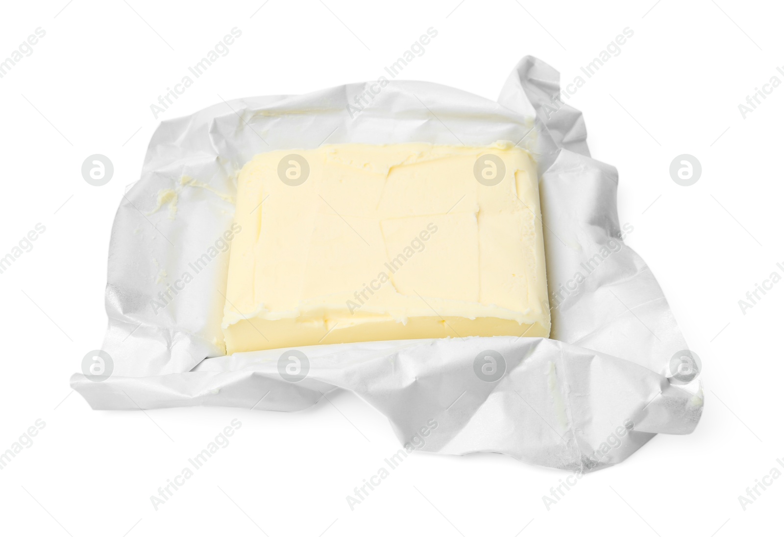 Photo of Block of tasty butter in open package isolated on white