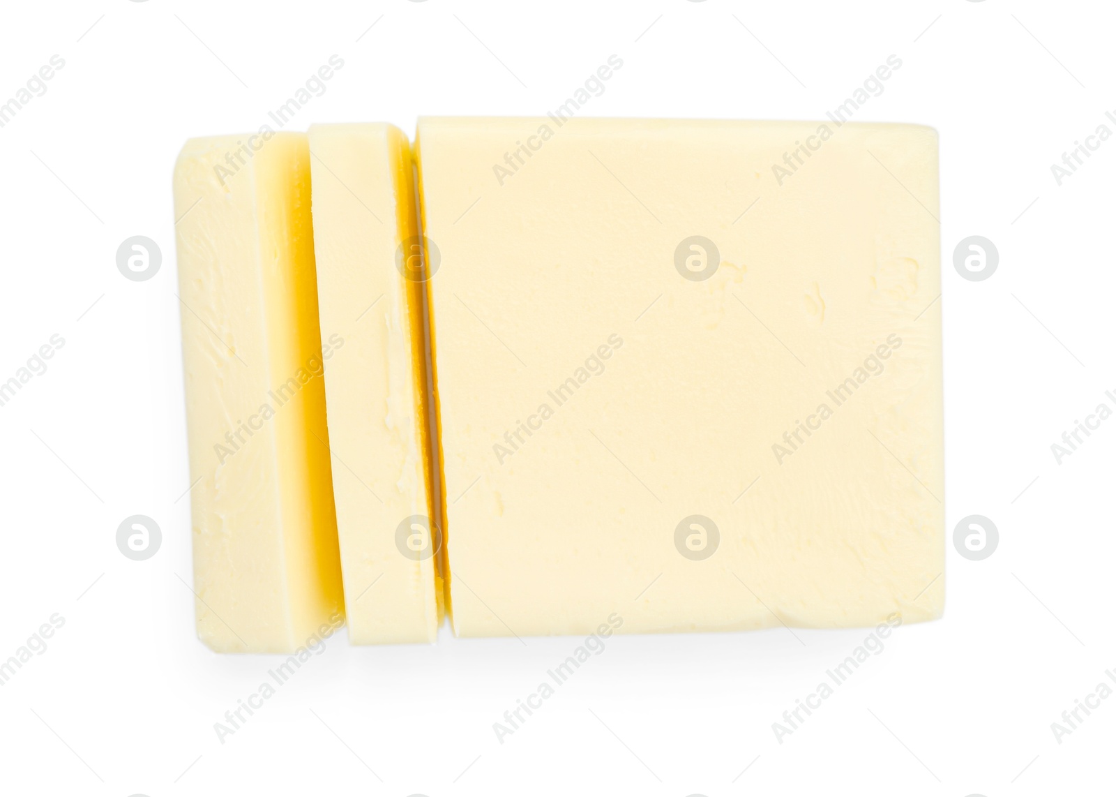 Photo of Cut tasty butter isolated on white, top view