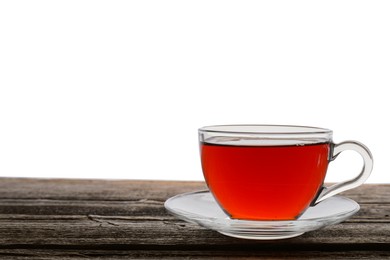 Refreshing black tea in cup on wooden table against white background